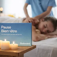 Person getting a back massage with a 'Pause Bien-être' box and lit candles.