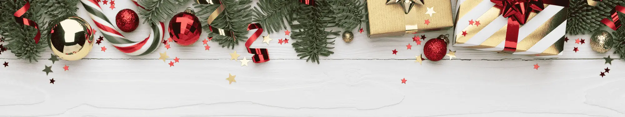 Christmas border with fir branches, red and gold ornaments, candy canes, and gifts.