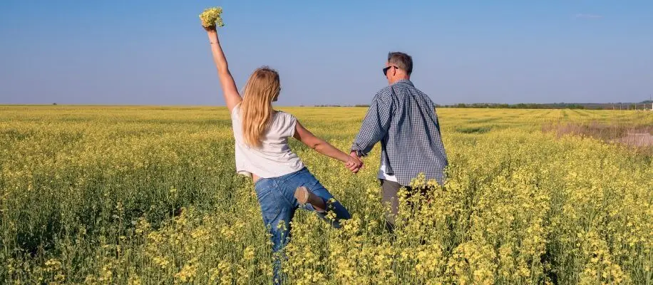 Couple walking in fields