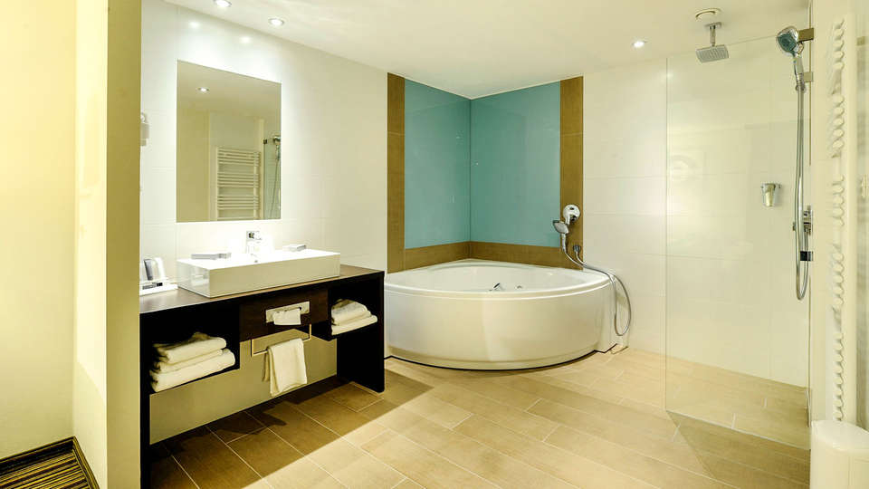 Kom tot rust in een romantische suite met jacuzzi