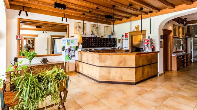 Romance et bien-être à Cortina d'Ampezzo dans une chambre avec sauna privé et dîner