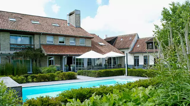 Overnachting in een 'Heritage' kamer met zicht op de tuin en openluchtzwembad