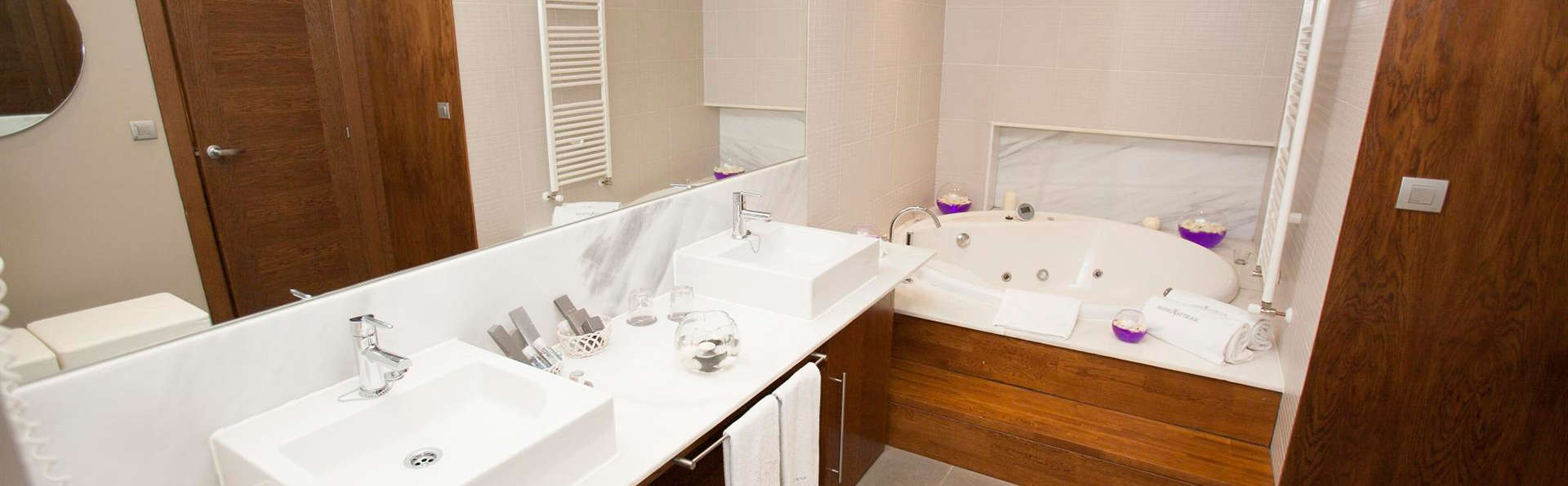 Escapade Premium avec jacuzzi privé dans la chambre et accès au spa.